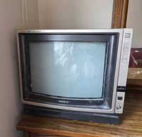 Front view of Sony 13" Trinitron CRT TV on wooden surface