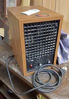 Full view of Living Air XL15 air purifier showing wood-grain cabinet and power cord