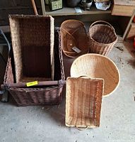 Group view of six assorted wicker baskets in various shapes and sizes