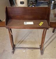 Full front view of wooden side table bookshelf with pull-out shelves extended