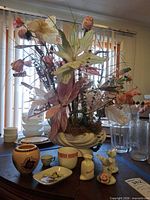 Full lot showing floral arrangement, vases, cups, tray and figurines