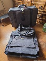 Entire set showing both suitcases, garment bag and duffle bag