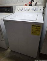 Front view of GE washer showing control panel and EnergyGuide label