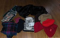 Group view of scarves, gloves, mittens and black faux fur hat