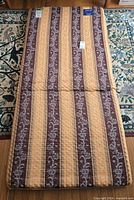 Full view of foldable sleep pad showing fabric pattern