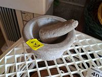 Top view of mortar and pestle set showing overall form and stone texture