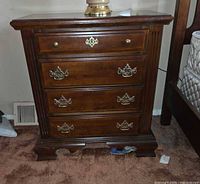 Front view showing four drawers and hardware