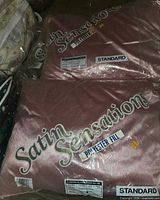 Packaged Satin Sensation standard satin pillow showing label
