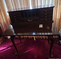 Front view of Thomasville secretary desk with drop front open showing drawers and cubbies