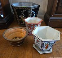 group shot of four planters showing sizes and styles