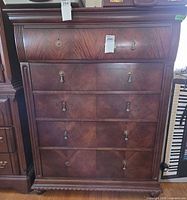 Front view showing full chest and drawer layout