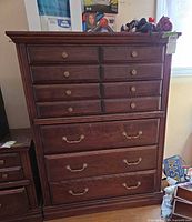 Front view showing full chest with drawers and hardware