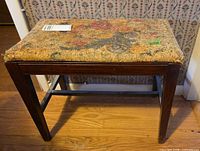 Full view of mahogany bench against wall