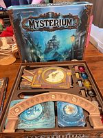 Box lid showing Mysterium artwork