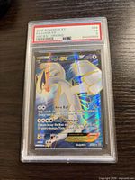 Front view of PSA-slabbed Lugia EX card showing holographic artwork and grade label