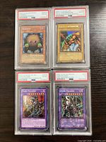 All four PSA graded Yu-Gi-Oh cards in slabs