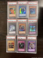 Overview of nine PSA-slabbed Yu-Gi-Oh! cards
