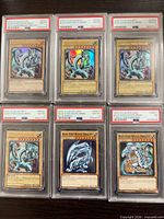 All six PSA-graded Blue-Eyes White Dragon cards displayed in two rows