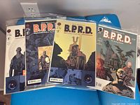Four assorted B.P.R.D. issues including Hollow Earth arc, bagged and boarded
