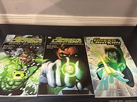 Front covers of all three Green Lantern trade paperbacks