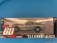 Front of sealed package showing die-cast Mustang and graphics