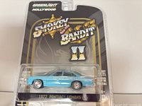 Front of sealed blister packaging showing car and branding