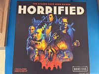 Front of Horrified board game box