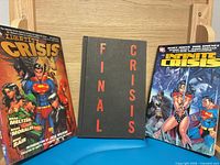 Front covers of Identity Crisis, Final Crisis, Infinite Crisis graphic novels