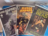 Front covers of Abe Sapien, Sledgehammer 44, Amazing Screw-On Head