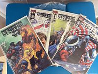 Four Rising Stars issues in bags on blue surface