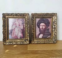 Front view showing both gold ornate frames with art prints