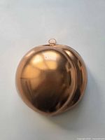 Front view of copper plum mold