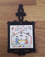 Front view of entire trivet showing frame and tile design