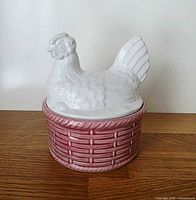 Front view of assembled hen on nest dish