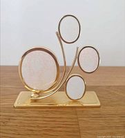 Front view showing brass tree frame with four openings