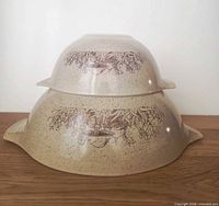 Side view of both bowls stacked showing exterior pattern and color