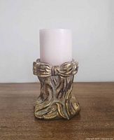 Full view of candle holder with pink candle inserted