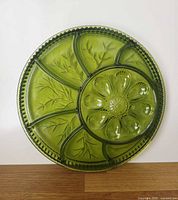 Full view of green glass Tree of Life deviled egg and relish tray