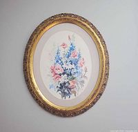 Full view of framed oval floral watercolor painting