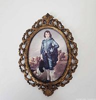 Front view of ornate brass frame with Blue Boy print displayed