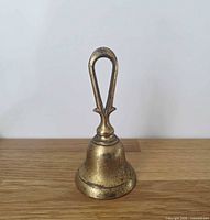 full view of bell front side on wood surface