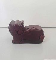 Closed wooden cat puzzle box side view