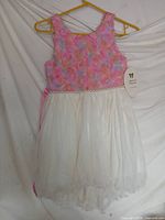 Full view of dress on hanger showing overall design