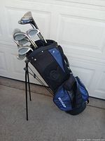 Full view of Dunlop stand bag loaded with clubs standing on its legs