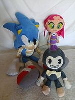 Front view of all three plush toys: Sonic, Starfire and Bendy