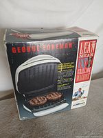 Front of retail box showing grill image and branding