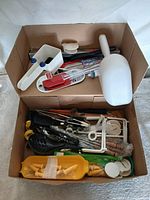 Full box view showing both upper and lower compartments with mixed utensils