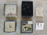 Group shot showing all six boxed/card items