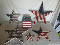 All six items grouped: five patriotic stars and striped utility box