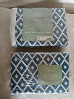 Front view of packaged sheet set showing brand, pattern and size